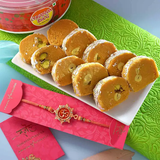Auspicious Om Rakhi And Batisha Slice Combo egypt | Gift Auspicious Om ...