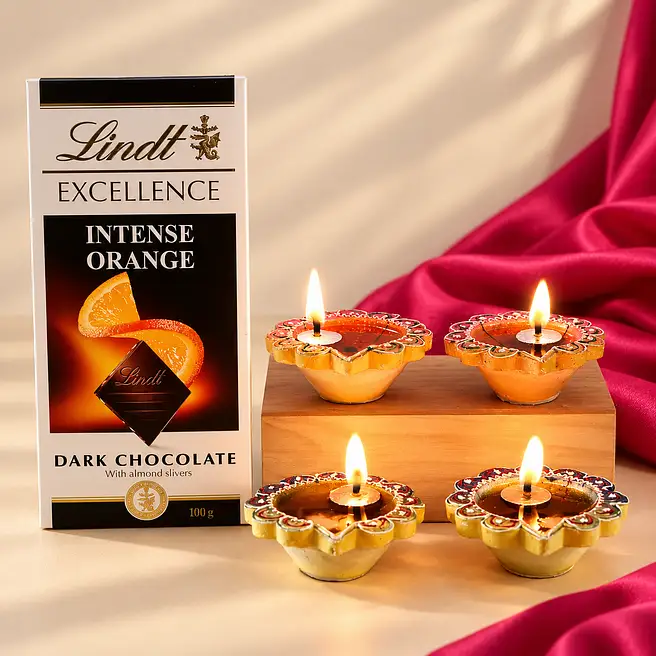 Set Of 4 Designer Diyas And Lindt Orange Intense Dark