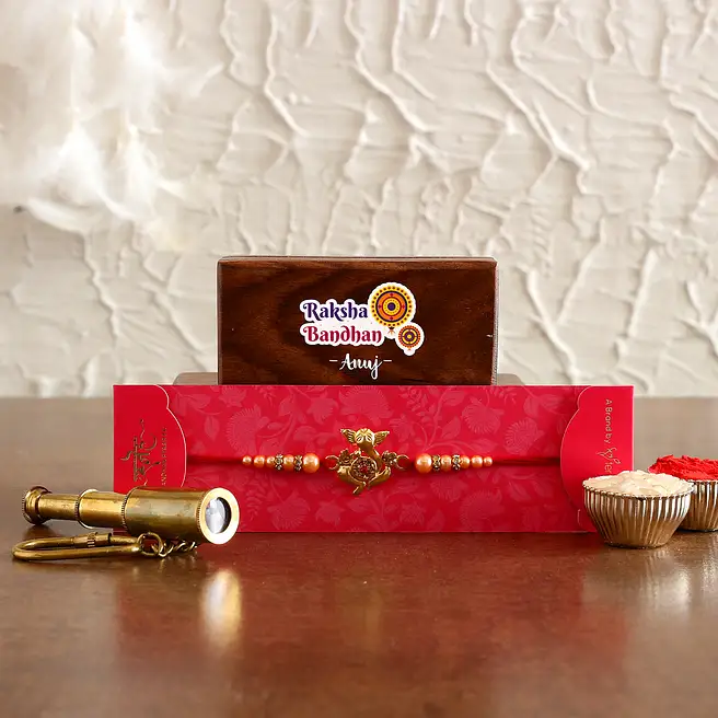 Ganesha Rakhi and Personalised Telescope Keychain Hamper greece | Gift ...