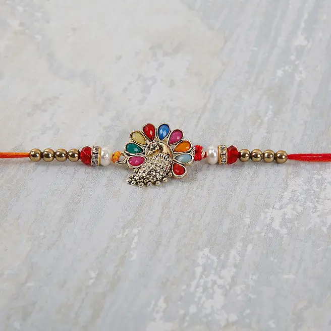 Buy/Send Vibrant Peacock Rakhi Online- FNP
