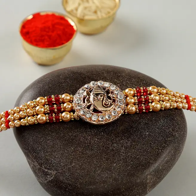 Buy/Send Studded American Diamond Rakhi Online- FNP
