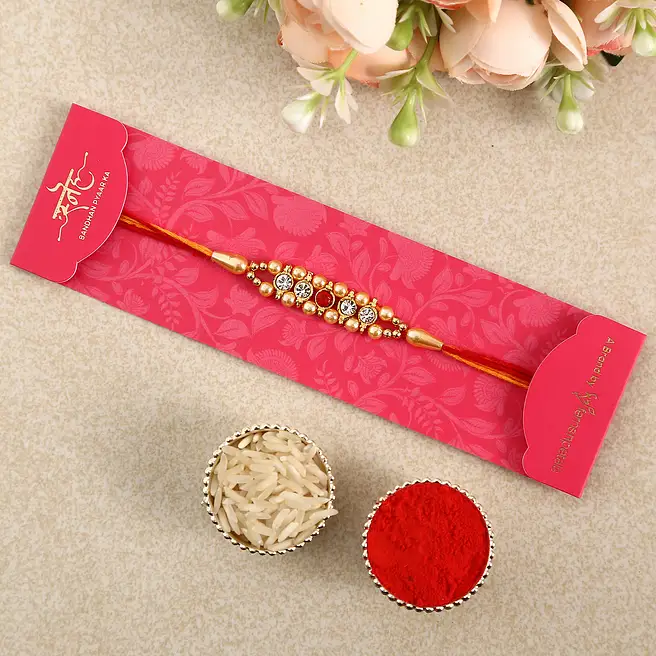 Buy/Send Striking American Diamond Rakhi Online- FNP