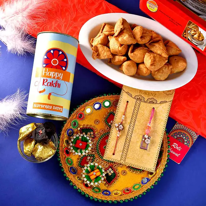 Buy/Send Ethnic Bhaiya Bhabhi Rakhi Set & Sweet N Savoury Treats Online ...