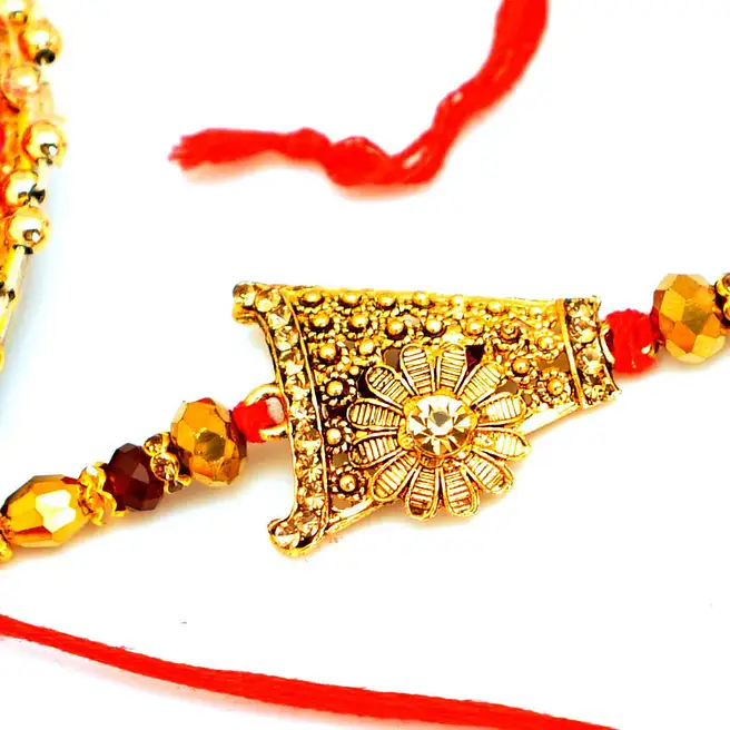 Gold Rakhi Models Exquisite Golden Rakhi usa | Gift Exquisite Golden Rakhi- FNP