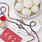 Vibrant Ganesh and Om Rakhi Duo N Rasgulla Delight